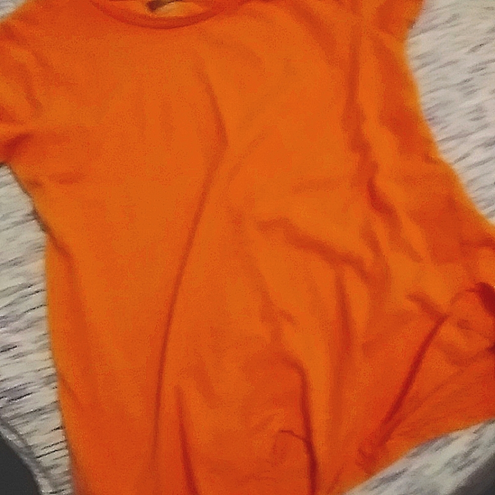 A light pinky orange shirt
